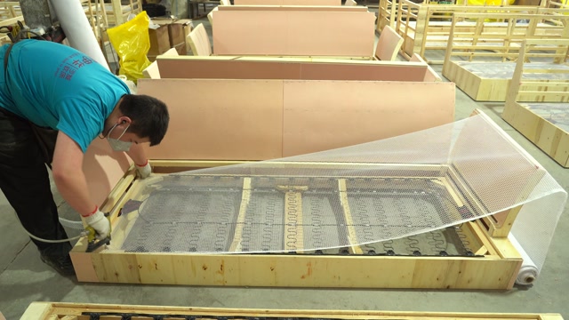 Sofa base assembly during GlobeWest's China manufacturing project